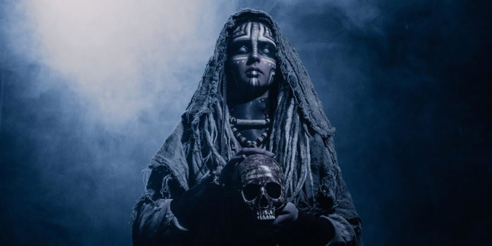 Pagan woman holding a skull